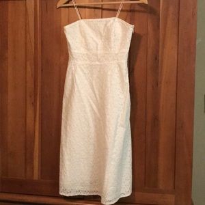 White eyelet. Small spot on back by hem. See photo